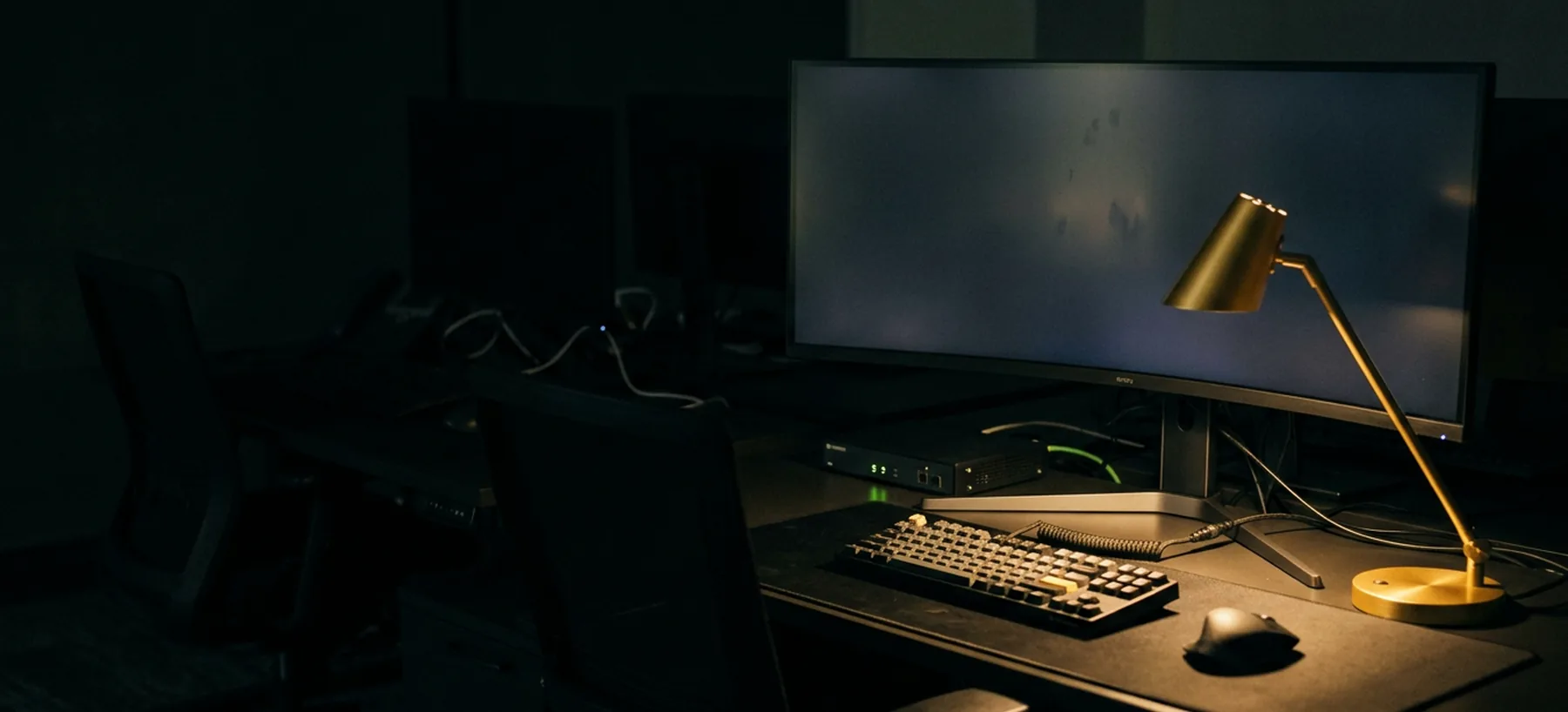 A developer workstation at night with a dark monitor