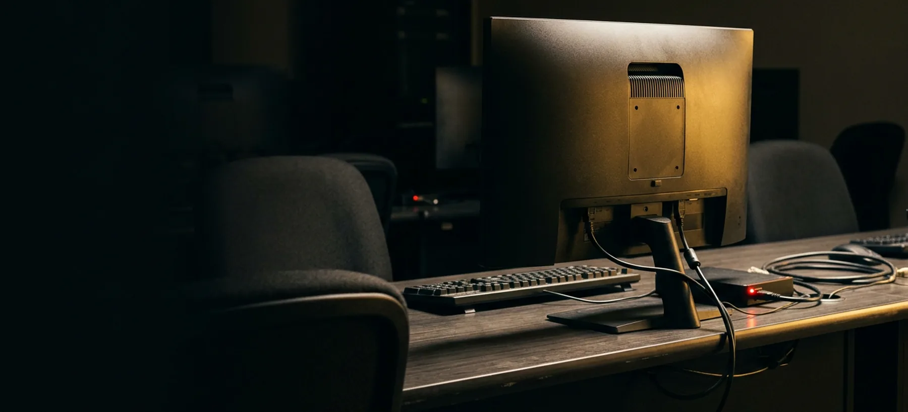 A single training workstation in a darkened classroom